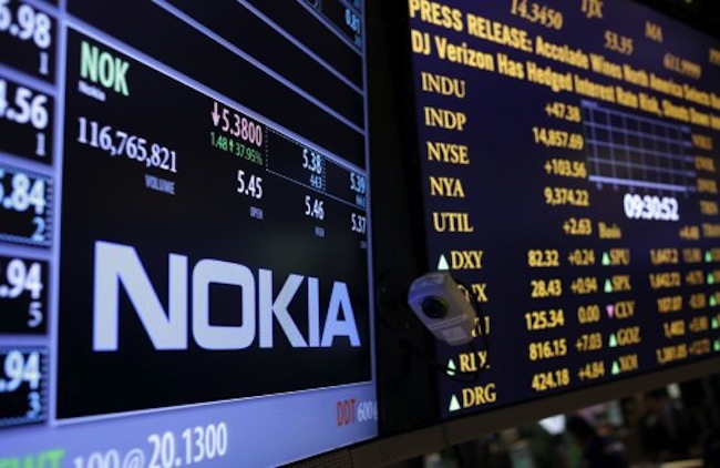 The Nokia brand name is displayed on the floor of the New York Stock Exchange in New York, Tuesday, Sept. 3, 2013. On Tuesday, Microsoft announced it would pay $7.2 billion to acquire Nokia's line-up of smartphones and a portfolio of patents and services. (AP Photo/Seth Wenig)