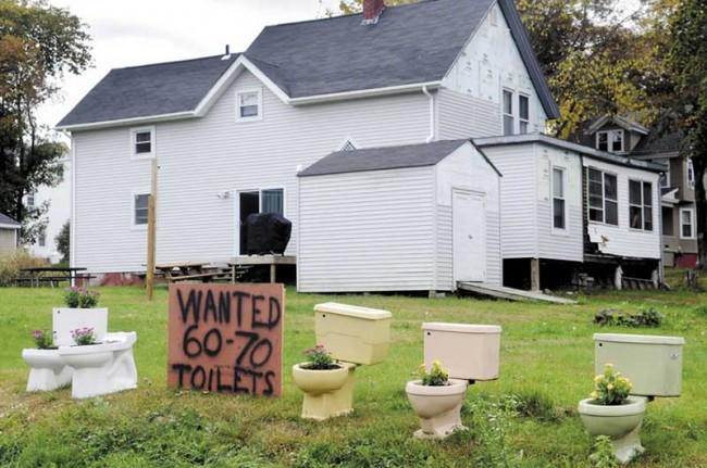 Dunkin Donuts row house Man refused Dunkin’ Donuts home upgrade puts toilets on his lawn