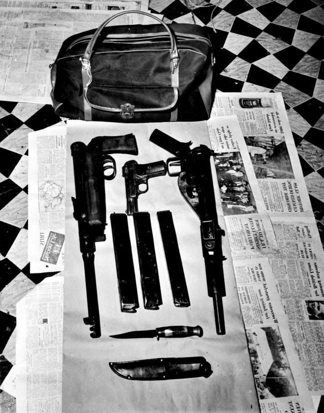 Scotland Yard issused this picture of a holdall and the weapons it contained. Some of the exhibits which helped to convict four of the accused in the Angry Brigade trial at the Old Bailey. *Police said the automatic weapons were used in attacks on the American and Spanish Embassies in London. The Holdall and it's contents were found at a flat in Amhurst Road,Stoke Newington, North London.