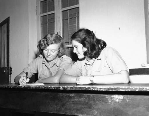 Two Jewish girls fill out their registration forms for the Jewish Army in Israel on Dec. 16, 1947. Many are now members of the semi-official Haganah.