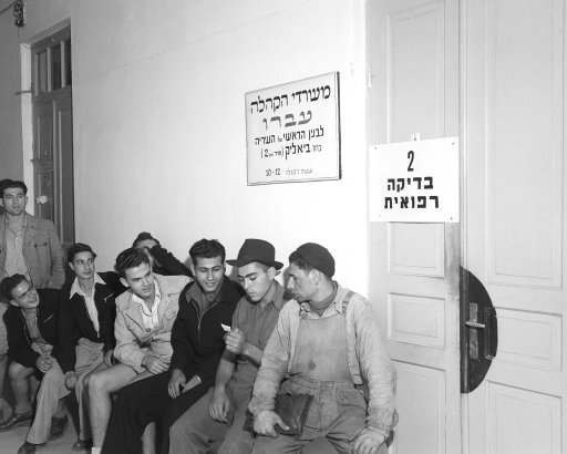 Young men and women from 17 to 25 years of age, called up for “essential duties,” principally military, started registering for the Jewish army. Although many are members of the semi-official Haganah, there were other youngsters eager to sign up to defend their homes against an Arab invasion. Volunteers wait for medical examinations in Israel on Dec. 16, 1947. 