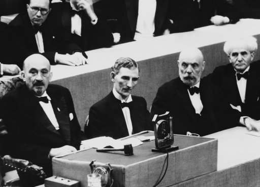 Dr. Chaim Weizmann, presiding over the 21st Zionist Congress in Geneva, mad an attack on Great Britain’s White paper proposals for the solution of the Palestine problem in his opening speech on August 17. Opposition has been determined on. Congress opened August 16. From left to right are Dr. Weizmann, Mr. Tom Williams, M.P., Mr. Ussischkin, and Mr. Ben Gurion at the Zionist congress at Geneva on August 16, 1939. Behind Dr. Weizmann is the Rev. Perlsweig, leader of English Zionism. (AP Photo)