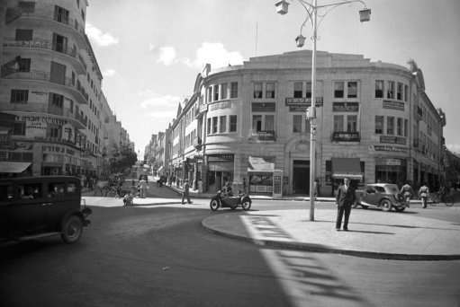 Modern American style of office building and skyscrapers apartment houses, finely paved wide streets and smart shops show the remarkable growth of New Jerusalem on Oct. 23, 1938. Under the leadership of American Jews, who have converted the holy city from a mere medieval village to a live progressive and prosperous city of the first class, the Arabs have profited very largely from the phenomenal growth of Jerusalem by the profitable sale of the land on which most of these buildings are constructed. (AP Photo)