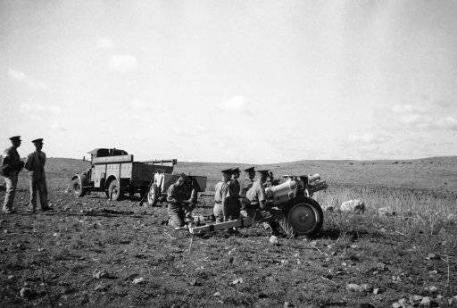 Latest British artillery with rubber-tired wheels, in action against Arab rebels in Palestine, Jan. 9, 1939.
