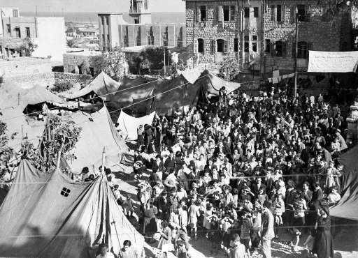 Some of the thirteen hundred Palestinian Armenian from Jaffa, Jerusalem and Haifa, in the tent camp in the grounds of the Armenian Church, Haifa, Oct. 29, 1947, where they are waiting for transport to Soviet Armenia. 