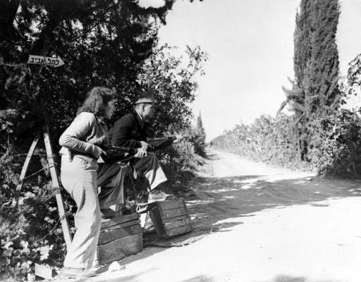 Members of the Jewish Defence Oraganisation Haganah, armed with sten guns, keep guard in an orange grove, near Rehovoth, Palestine, March 8, 1948, after arabs had attacked Jewish buses and convoys in the area. 