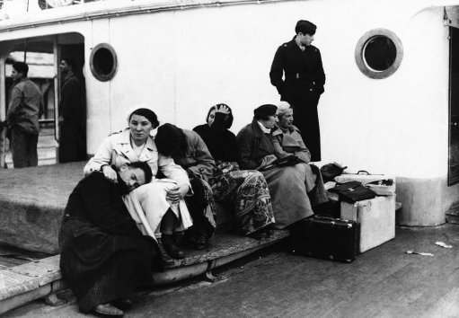 The tired groups shown above on the ship King Carol were a part of 318 homeless Jews barred from entering Palestine by the Quota system restricting immigration on Dec. 5, 1934. For two months they wandered vainly seeking a country where they would be permitted to land. Finally the polish government consented to receive them and they were landed at Constanza, Roumania and transported to Poland by train.