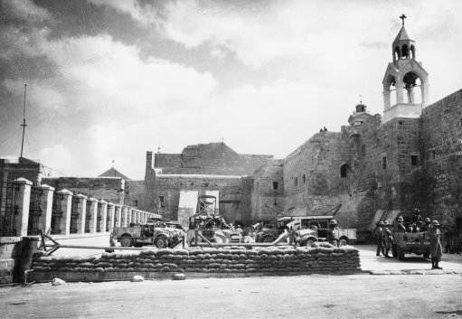 British machine guns and sandbag barricades are set up in the courtyard of the Church of the Nativity in Bethlehem, Palestine, Oct. 26, 1938.