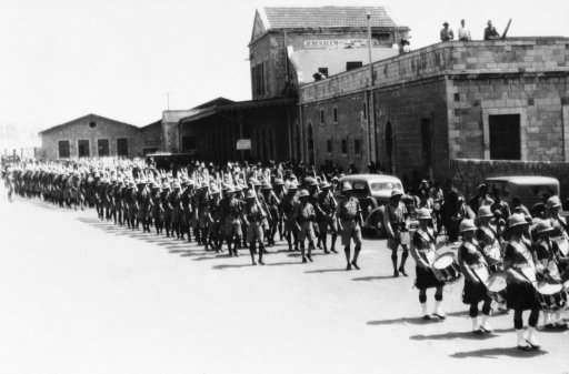 The second battalion of the Dorsetshire regiment was moved into the holy land to reinforce those quelling Arab-Jew riots. The troops are shown being piped into Jerusalem by the band of the Second Battalion on June 22, 1936. The queens own Cameron Highlanders