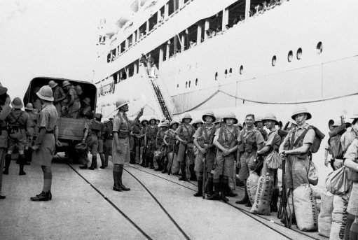 This time suppression of the Arab rebellion in Palestine is the British soldiers lot. After months of terrorism, loss of lives in the hundreds and loss of trade in the millions, Britain apparently is determined to halt the terror and is dispatching thousands of additional troops. Photo shows Tommies after disembarking from a transport at Haifa on Oct. 11, 1938, when they were to be assigned to the duties in Jerusalem and other disturbed points.