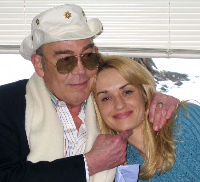 Hunter S. Thompson and his wife, Anita Thompson during their civil wedding ceremony, April 23, 2003, in Aspen, Colo. Hunter S. Thompson's ashes are to be blasted from a cannon mounted inside a sculpture of the journalist's ``gonzo fist'' emblem, his wife Anita said Tuesday, April 5, 2005. The cannon shot, planned sometime in August 2005, on the grounds of his Aspen-area home, is to fulfill the writer's long-cherished wish. Thompson, 67, shot himself in the head on Feb. 20, 2005. (AP Photo/Louisa Davidson, File)