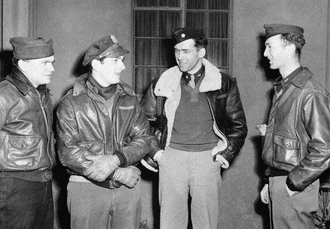 Film star Jimmy Stewart celebrates his promotion to major by leading his bomber group in a great raid on Frankfurt, Germany on Jan. 29, 1944. Left to right: Lt. John J. Rankin, bombardier, of Walhalla, S.C.; Lt. J.M. Steinhaven, navigator, of 125 Park Drive, River Forest, Ill.; Major James Stewart, command pilot and leader of the group; and Lt. F.W. Conley, pilot of Greenville, Maine. (AP Photo)