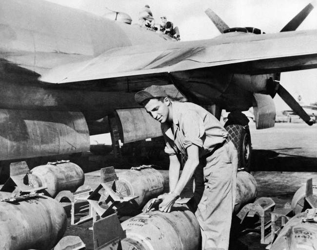 Sgt. John Greenstreet, the son of film actor, Sydney Greenstreet, handling bombs at the 20th Bomber Command in India on Feb. 6, 1945, where he is armament inspector. (AP Photo)
