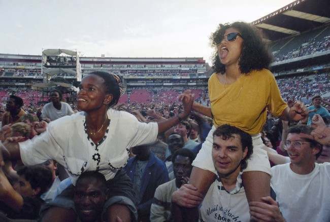 Fans at American singer Paul SimonÂs concert in the first of five concerts in Johannesburg, South Africa on Saturday, Jan. 11, 1992. The concert effectively marked the end of South Africa's cultural boycott. (AP Photo/Adil Bradlow)