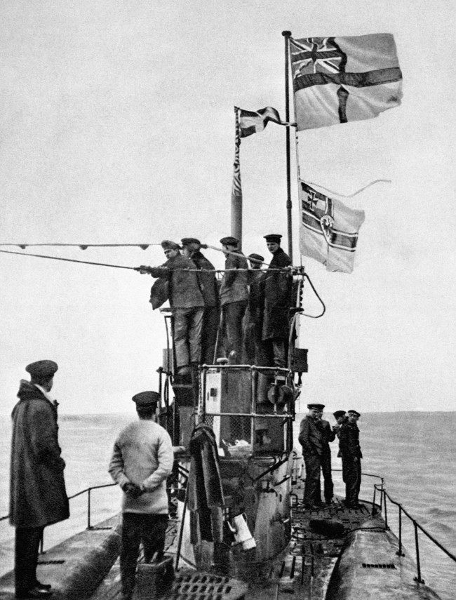 A view of the surrender of the German submarine U-48 to the Royal Navy at the Essex port of Harwich. The U-48 was one of 39 U-Boats to surrender, most of them in perfect condition. The White Ensign can be seen flying above the Imperial German Navy flag.