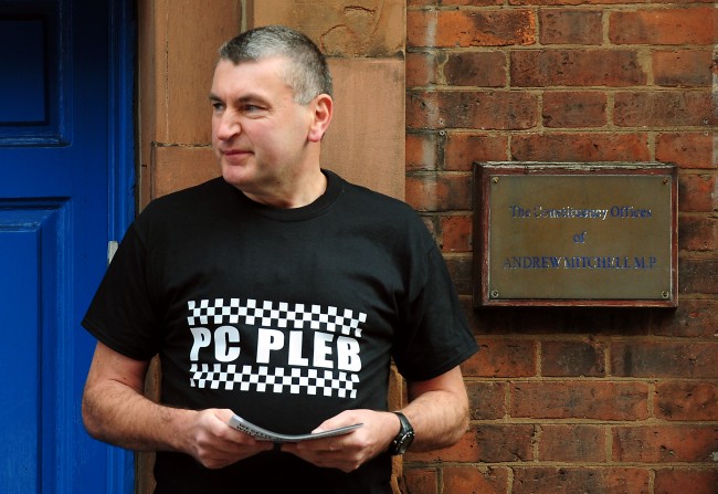 PC Mick Callaghan outside the constituency offices of MP Andrew Mitchell, for the launch of a poster campaign against police cuts, in Sutton Coldfield, West Midlands. Picture date: Wednesday September 26, 2012