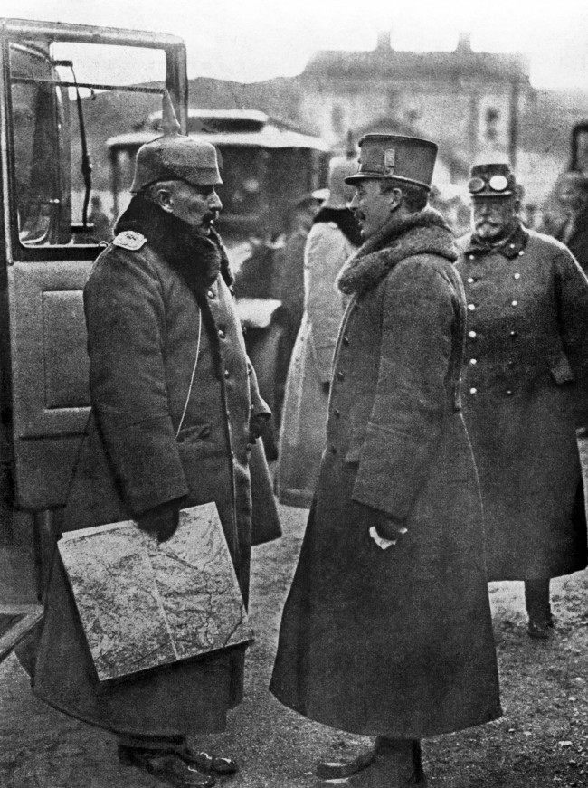 Kaiser Wilhelm II, the German Emperor, in conversation with Charles I, the Emperor of Austria, at a small railway station on the Italian Front.