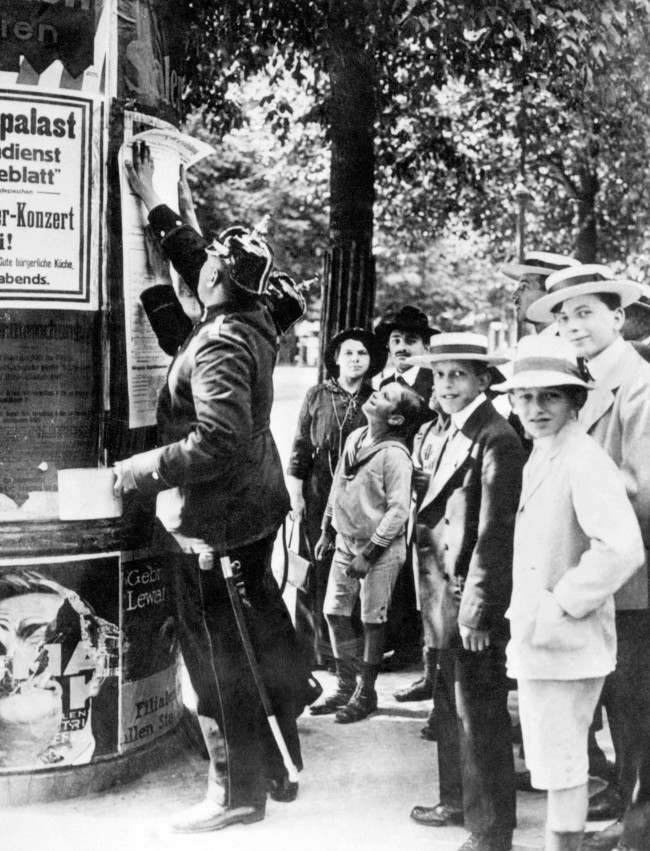 A German policeman posts a mobilisation order in Berlin at the beginning of the First World War.