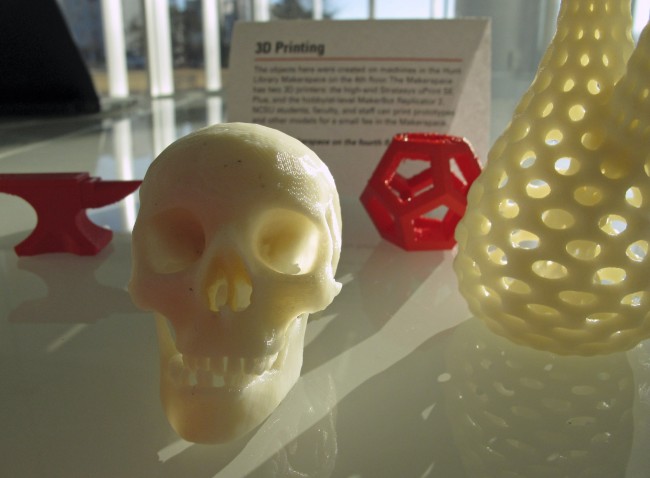 Tiny objects produced by a 3D printer sit on a table at the newly opened James B. Hunt Jr. Library at North Carolina State University in Raleigh on Friday, Jan. 4, 2013. The printer, an automated book retrieval system and walls that double as video screens are among the many innovations in the new, state-of-the-art facility.