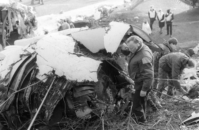 The right engine of the crashed Boeing 737 is inspected by Mr Ed Trimble, principal engineering inspector of the Department of Transport's Air Accident Investigation Branch at the scene of Sunday's crash on the M1 motorway near Kegworth, Leicestershire. Date: 11/01/1989