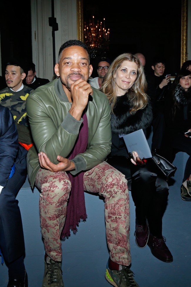 Actor Will Smith, centre, attends the Valentino's men's Fall-Winter 2014-2015 fashion collection, presented Wednesday, Jan. 15, 2014 in Paris. (AP Photo/Jacques Brinon)