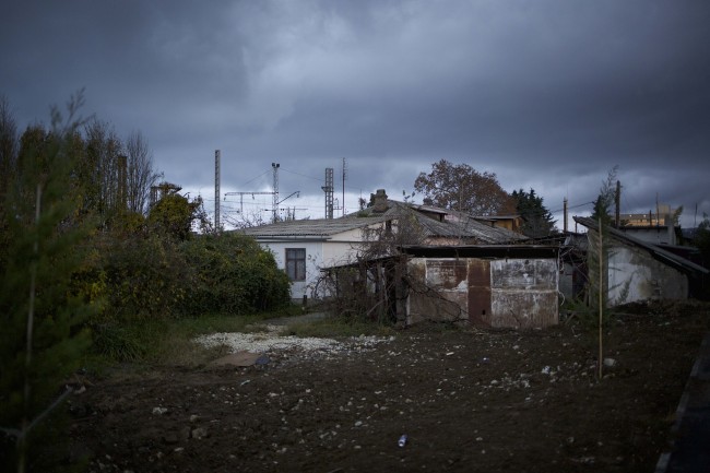 In this photo taken on Wednesday, Nov. 27, 2013, the 5a street Akatsiy's house is in the village of Vesyoloye outside Sochi, Russia. As the Winter Games are getting closer, many Sochi residents are complaining that their living conditions only got worse and that authorities are deaf to their grievances. (AP Photo/Alexander Zemlianichenko)