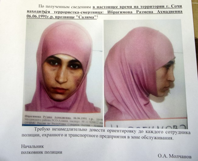 A photo of a police leaflet seen in a Sochi hotel on Tuesday, Jan. 21, 2014, shows Ruzanna Ibragimova and states that she is at large in the city of Sochi. Russian security officials are hunting down three potential female suicide bombers, one of whom is believed to be in Sochi, where the Winter Olympics will begin next month. Police leaflets seen by an Associated Press reporter at a central Sochi hotel on Tuesday contain warnings about three potential suicide bombers. Police said that Ruzanna Ibragimova, depicted in a mug shot wearing a pink hijab, was at large in Sochi. (AP Photo/Natalya Vasilyeva)