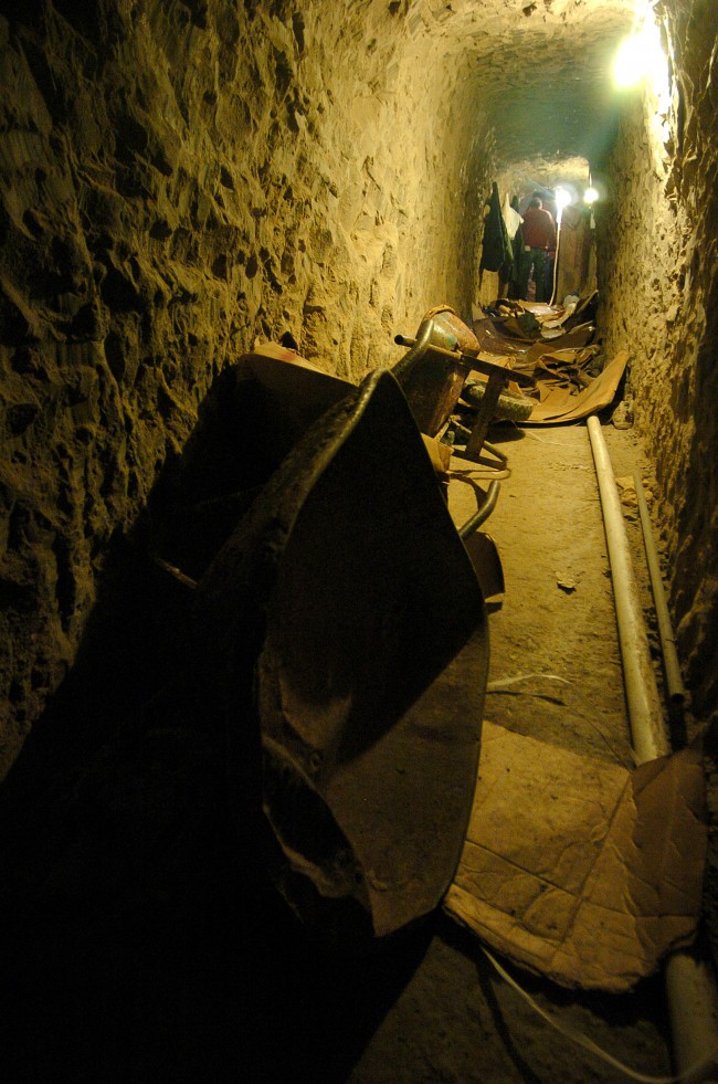 Wheelbarrows sit on the ground of a sophisticated clandestine tunnel that passes under the US-Mexico border on Wednesday, Jan. 25, 2006 in Tijuana, Mexico. The tunnel, which is about 2,400 feet long and around 60 feet underground, is accessed through a large concrete block shaft in a warehouse south of the border wall. (AP Photo/David Maung)