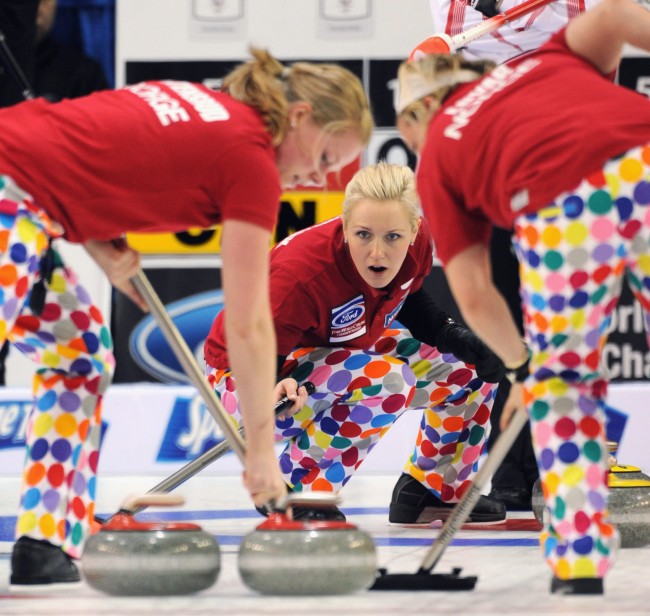 This photo made March 21, 2010, shows Norway's skip Linn Githmark, center, during an evening draw against Canada in Swift Current, Sask. There was a large package waiting for Norway when the team arrived in Swift Current, Sask., for the women's world curling championship. Out of the box came even louder versions of the loud pants their male counterparts popularized at the Winter Olympics in Vancouver last month.(AP Photo/The Canadian Press/HO, Michael Burns)