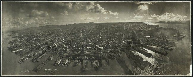 Photograph of San Francisco in ruins from Lawrence Captive Airship, 2000 feet above San Francisco Bay overlooking water front. Sunset over Golden Gate