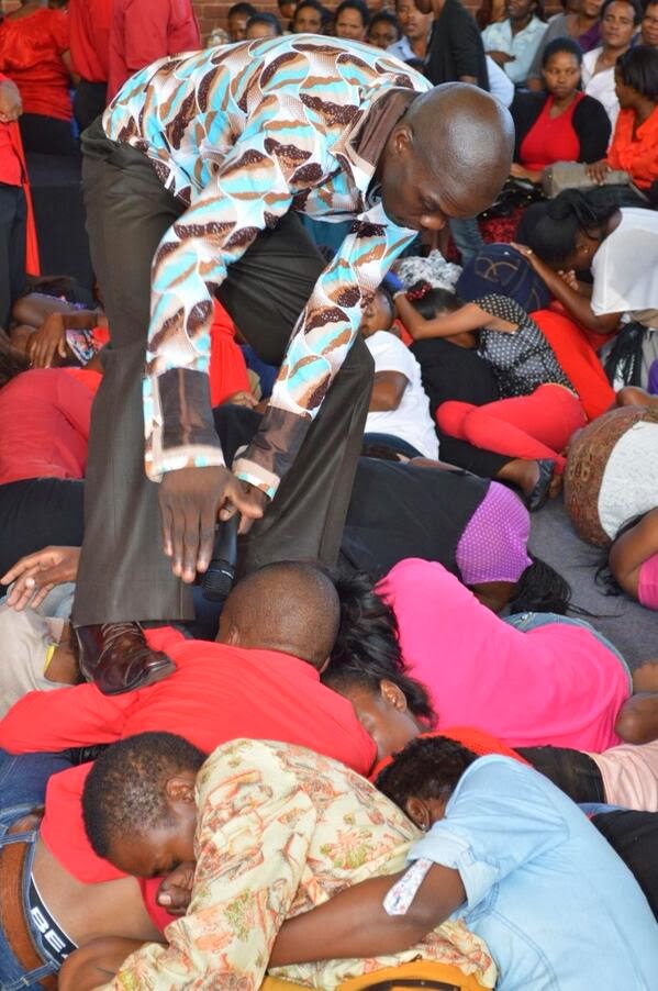 pastor walking shoes South African Pastor Walks On Congregation And Makes Them Eat Grass As He Commands Demons