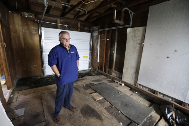 Dann Sears, curator of the Aberdeen Museum of HIstory, stands in the garage of the childhood home of Kurt Cobain