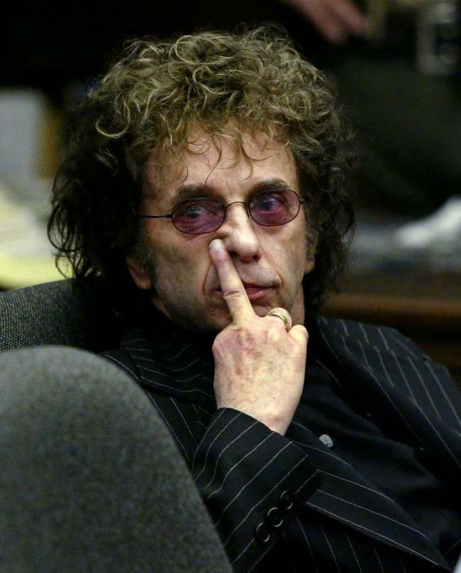Music producer Phil Spector gestures as he looks at deputy district attorney Douglas Sortina address Alhambra Superior Court judge Carlos Uranga during a hearing Friday, May 7, 2004, in Alhambra, Calif. 