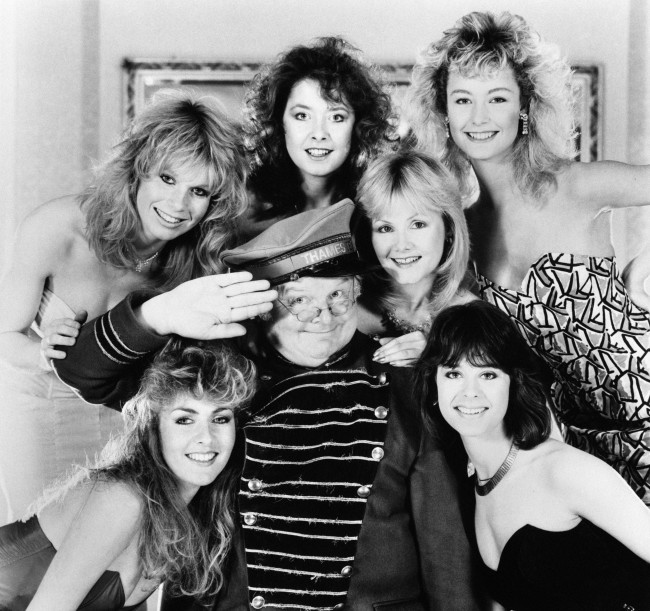 Comedian Benny Hill with his Hill's Angels in 1986: (top, l-r) Selina Caston, Lorraine Doyle, Sue Upton, Natalie Rolls; (bottom, l-r) Zoe Bryant, Liz Jobling.