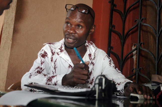 David Kato, a Ugandan gay-rights activist, poses for photographs at a restaurant in Kampala, Uganda, Tuesday, Dec. 8, 2009. Proposed legislation would impose the death penalty for some gay Ugandans, and their family, friends and even landlords also could face up to seven years in jail if they fail to report them to authorities. Kato became an activist after he was beaten up four times, arrested twice, fired from his teaching job and outed in the press because he is gay.