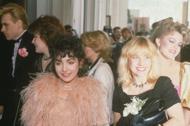 Members of the female rock group the Go-Go's arrive at the 24th Annual Grammy Awards in Los Angeles, Ca., on Feb. 24, 1982. Three of the five group members are Jane Wiedlin, left foreground, Charlotte Caffey, center, and Belinda Carlisle, right.