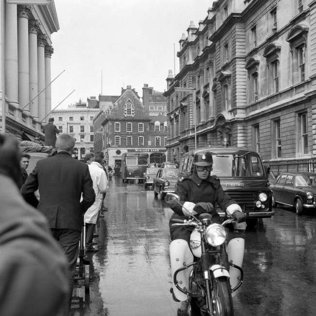 A police Black Maria van is escorted from Bow Street Magistrates Court, taking Ronald and Reginald Kray back to Brixton Prison after they were remanded in custody, charged with murder. PA/PA Archive/Press Association Images