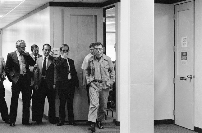 James Earl Ray, who is serving a 99 year sentence for the death of Dr. Martin Luther King, Jr., walks from the court room at Wartburg, Tennessee on Oct. 27, 1977, where is was being tried for escape. Ray was found guilty and given a sentence of one to two years on Thursday. 