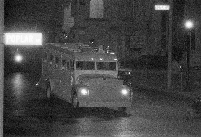 Armored truck, borrowed for the occasion from Jackson, Mississippi, officials, delivers James Earl Ray to the Shelby County Jail in Memphis, Tennessee, July 18, 1968, before dawn, following his flight from London. Inside the van, Ray was wearing safety equipment of material similar to the military flak vest.