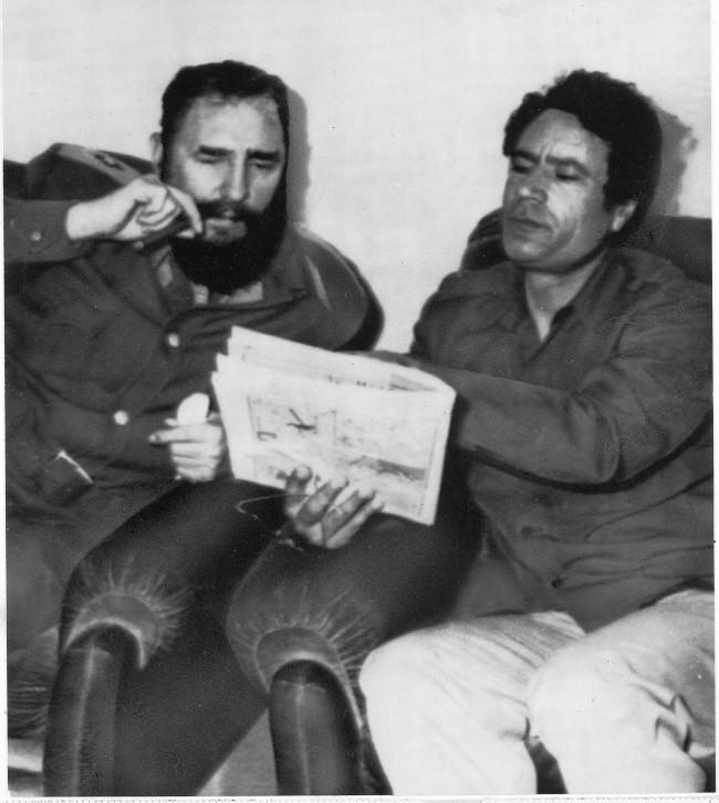 Cuban Prime Minister Fidel Castro, left, and Libyan leader Col. Muammar Gaddafi pore over a document during a meeting of delegates from both their countries in Tripoli. Castro is in Libya as a guest of the country.