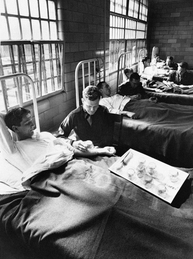 In this June 25, 1945 picture, army doctors expose patients to malaria-carrying mosquitoes in the malaria ward at Stateville Penitentiary in Crest Hill, Ill. Around the time of World War II, prisoners were enlisted to help the war effort by participating in studies that could help the troops. A series of malaria studies at Stateville Penitentiary in Illinois and two other penitentiaries were designed to test antimalarial drugs that could help soldiers fighting in the Pacific. Shocking as it may seem, government doctors once thought it was fine to experiment on disabled people and prison inmates.