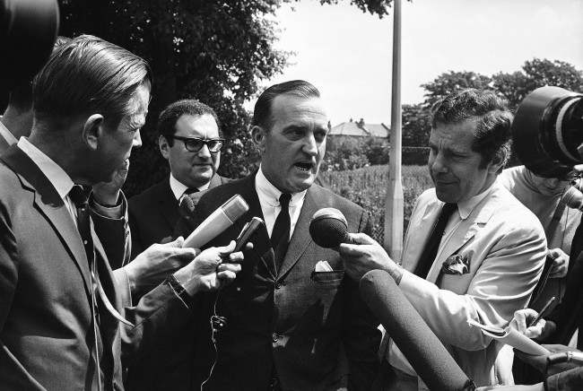 Birmingham, Alabama, lawyer Arthur J. Hanes talks with members of the press outside Wandsworth Prison, London on July 5, 1968, after he had conferred with Raymond George Sneyd. British Court had accepted the Federal Bureau of Investigation (F.B.I.) testimony that Sneyd is really James Earl Ray, the man wanted by the State of Tennessee in connection with the slaying of Dr. Martin Luther King. Behind Hanes is George Monygomery of the National Broadcasting Company.