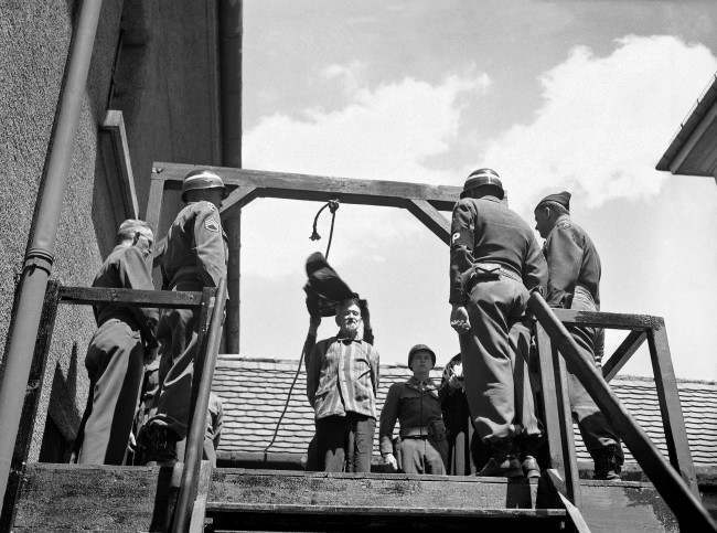 U.S. military authorities prepare to hang Dr. Klaus Karl Schilling, 74, at Landsberg, Germany on May 28, 1946. In a Dachau war crimes trial he was convicted of using 1,200 concentration camp prisoners for malaria experimentation. Thirty died directly from the inoculations and 300 to 400 died later from complications of the disease. His experiments all with unwilling subjects began in 1942.