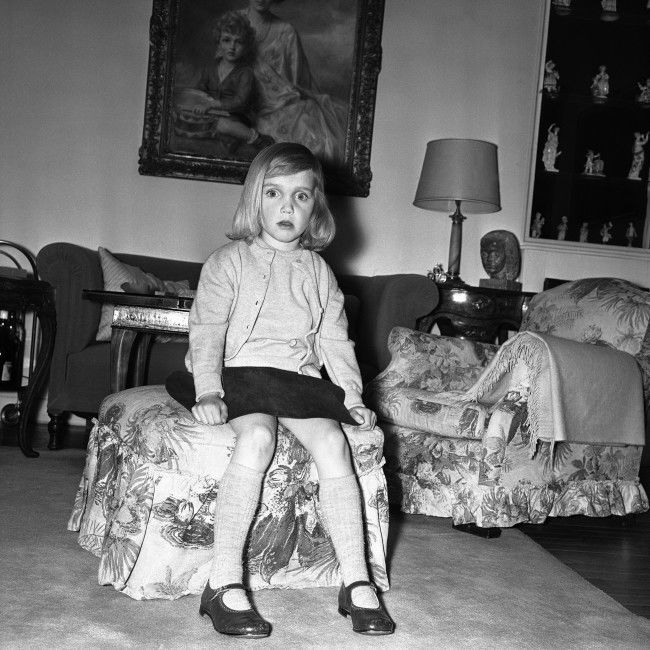 Sitting on a stool, little Princess Elisabeth of Austria, eldest daughter of Archduke Ferdinand and Archduchess Helene von Habsburg-Lothringen, poses on March 8, 1963 at her home in Paris, France. She is going to be one of the bridesmaids at the wedding of Princess Alexandra of Kent to the Honourable Angus Ogilvy on April 24, 1963. 