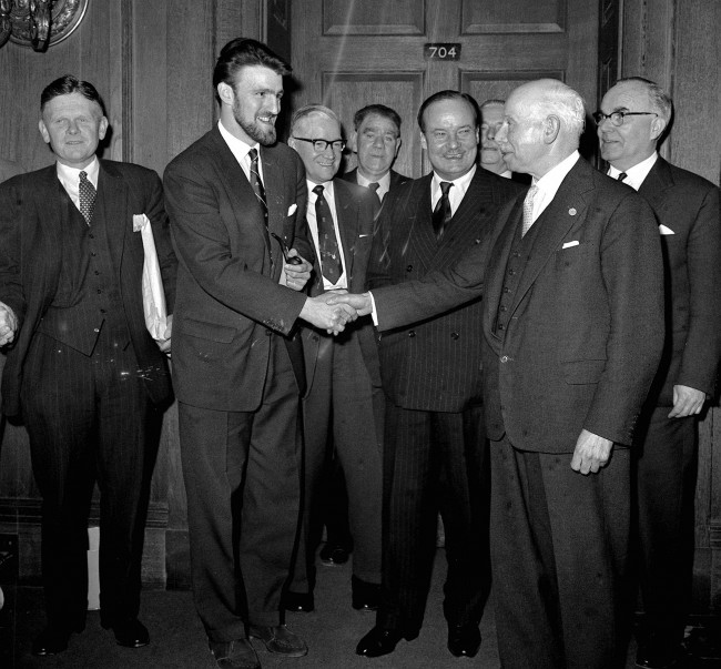 Jimmy Hill (2nd left, beard), Chairman of the Professional Footballers' Association, shakes hands with Joe Richards, President of the Football League, and John Hare (striped suit), at the Ministry of Labour in London. * ...after attending a successful four-and-a-half-hour meeting to discuss football players' conditions and pay. A strike was called off as agreement was reached between the football league and the PFA in the presence of John Hare, Minister of Labour. Date: 18/01/1961