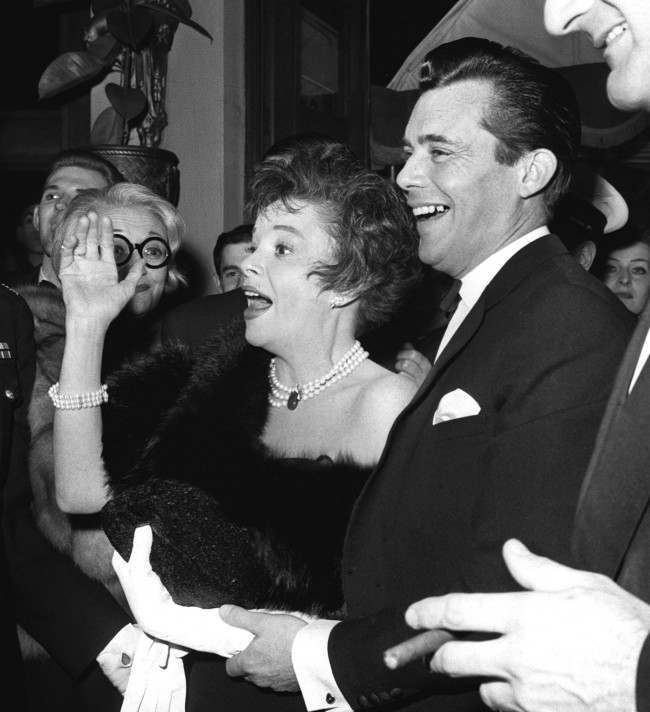 Actress, Judy Garland and her co star Dirk Bogarde arrive at the Plaze cinema, Piccadilly Circus, London for the premiere of their film, 'I Could Go On Singing'.