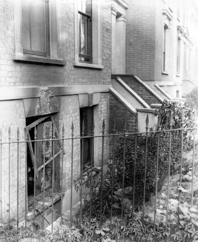 The basement windows of a bombed house following a zeppelin raid, from which a woman and baby escaped. Date: 01/01/1915