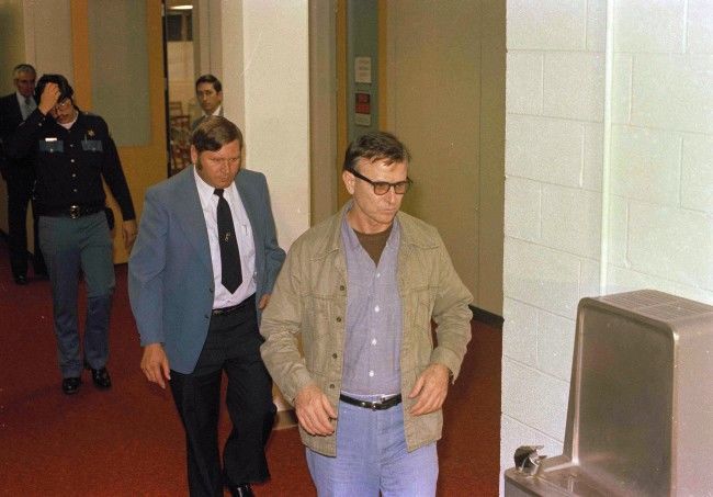 James Earl Ray, wearing jacket and tie, is shown at his escape trial in Tennessee, Nov. 1977.