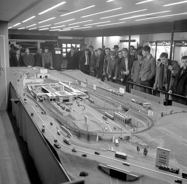 Drawing crowds at the British Railways (London Midland Region) railway exhibition taking place in Manchester is this 30ft long working model of the railway terminal at the British end of the proposed Channel Tunnel. The model includes the main terminal buildings containing a passenger station, car and lorry-loading platforms and a working railway layout with an Anglo-Continental freight marshalling yard.