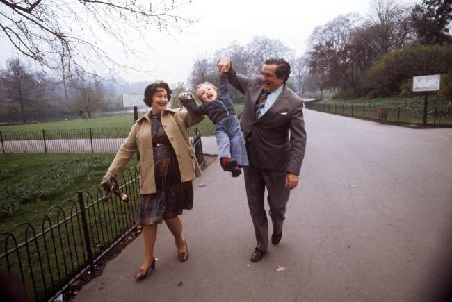Chancellor of the Exchequer Denis Healey, taking time out from his preparations for next week's Budget, is joined by his wife Edna and their 18-month-old grandson Thomas Copsey for a stroll in St James's Park, London.